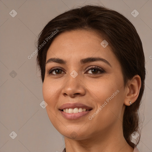 Joyful white young-adult female with long  brown hair and brown eyes