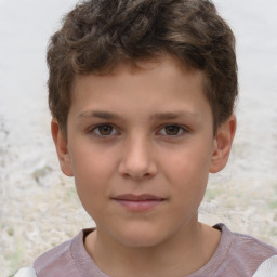 Joyful white child male with short  brown hair and brown eyes