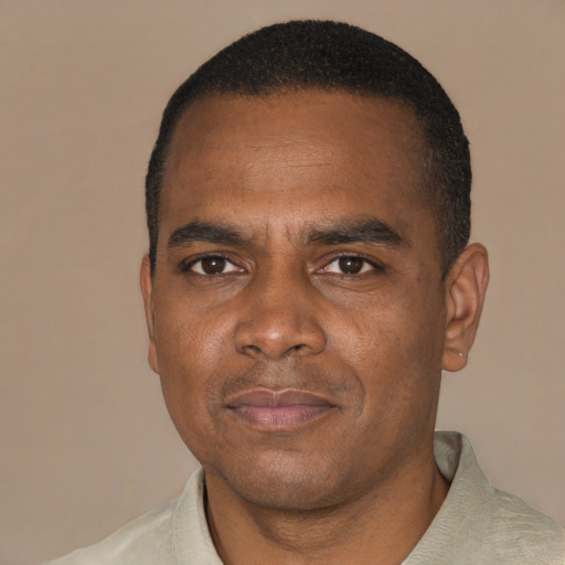 Neutral black adult male with short  black hair and brown eyes