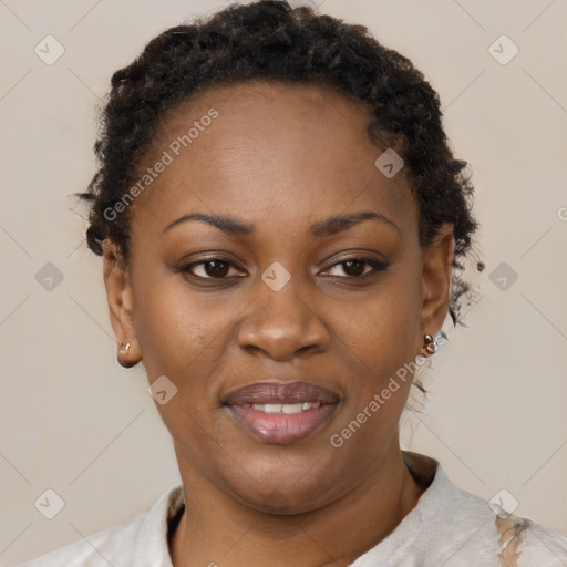 Joyful black adult female with short  brown hair and brown eyes