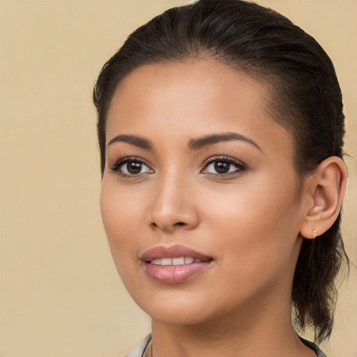 Joyful white young-adult female with long  brown hair and brown eyes