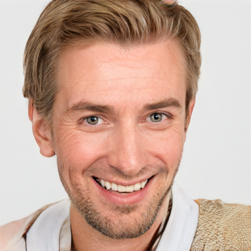 Joyful white adult male with short  brown hair and grey eyes