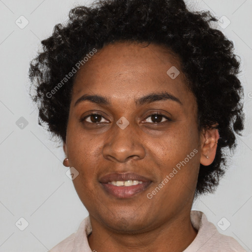 Joyful black adult female with short  brown hair and brown eyes