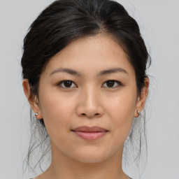 Joyful asian young-adult female with medium  brown hair and brown eyes