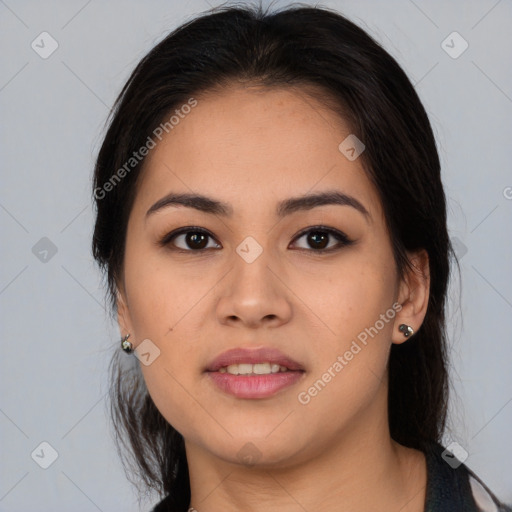 Joyful latino young-adult female with long  brown hair and brown eyes