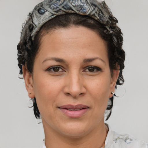 Joyful white adult female with short  brown hair and brown eyes