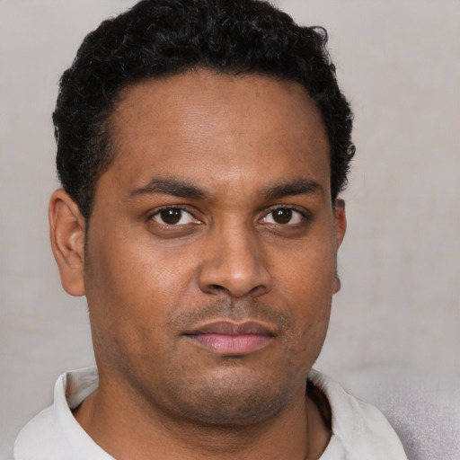 Neutral black young-adult male with short  brown hair and brown eyes