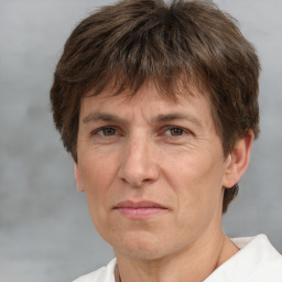 Joyful white middle-aged male with short  brown hair and brown eyes