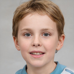 Joyful white child female with short  brown hair and grey eyes