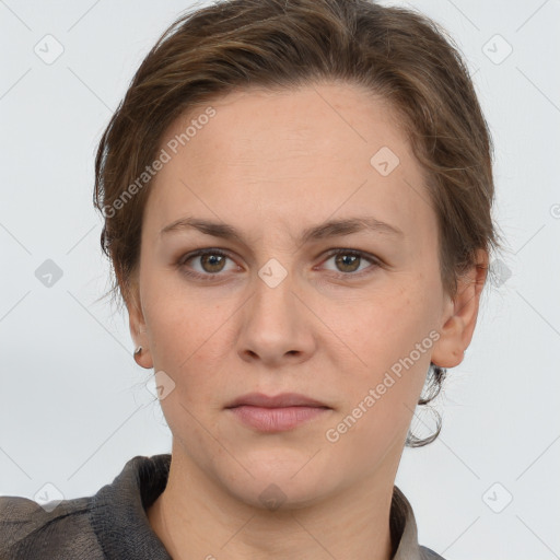 Joyful white adult female with short  brown hair and grey eyes