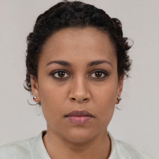 Neutral latino young-adult female with short  brown hair and brown eyes
