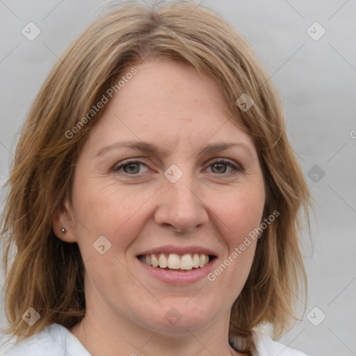 Joyful white adult female with medium  brown hair and blue eyes