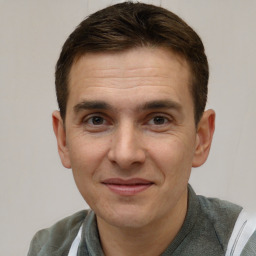 Joyful white adult male with short  brown hair and brown eyes