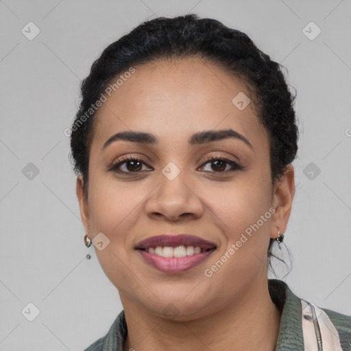 Joyful latino young-adult female with short  black hair and brown eyes