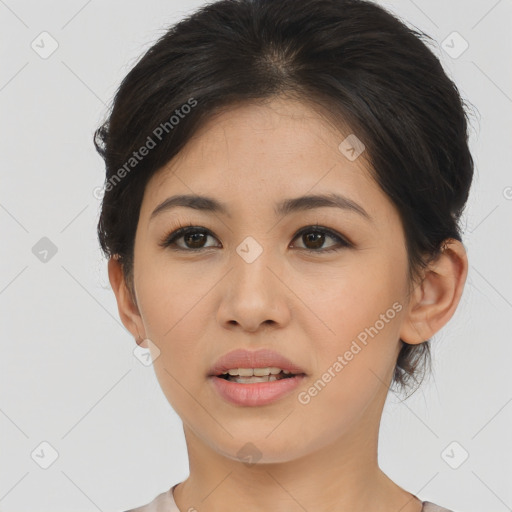 Joyful asian young-adult female with short  brown hair and brown eyes