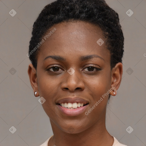 Joyful black young-adult female with short  brown hair and brown eyes