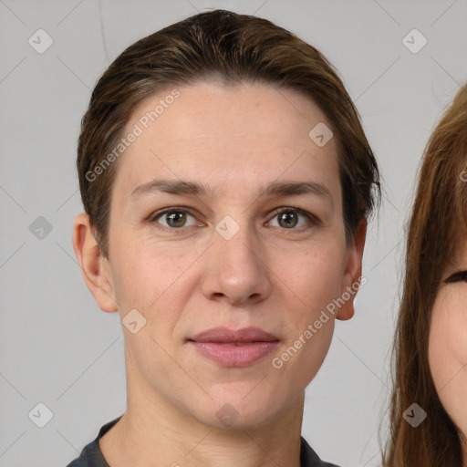 Joyful white young-adult female with short  brown hair and grey eyes