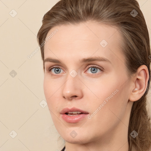 Neutral white young-adult female with long  brown hair and blue eyes