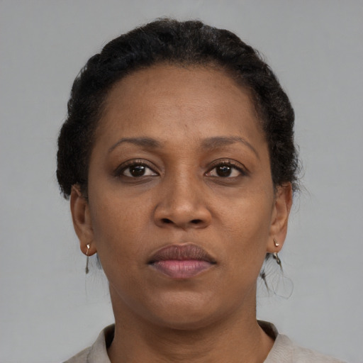 Neutral black adult female with short  brown hair and brown eyes