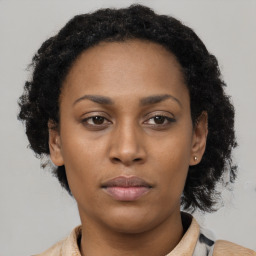 Neutral black young-adult female with short  brown hair and brown eyes