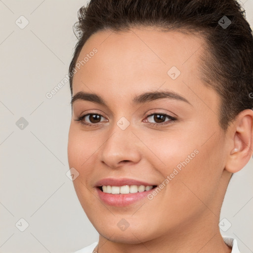 Joyful white young-adult female with short  brown hair and brown eyes