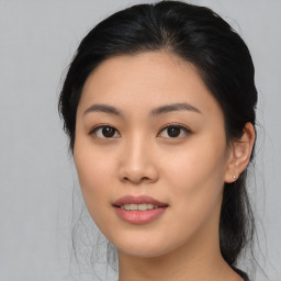 Joyful asian young-adult female with medium  black hair and brown eyes