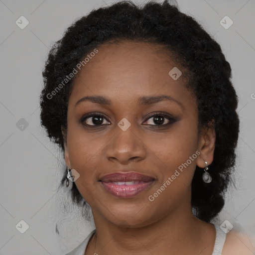 Joyful black young-adult female with long  brown hair and brown eyes