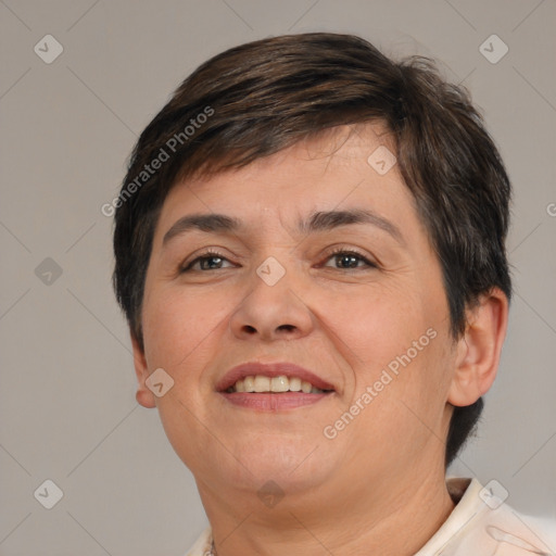 Joyful white adult female with short  brown hair and brown eyes