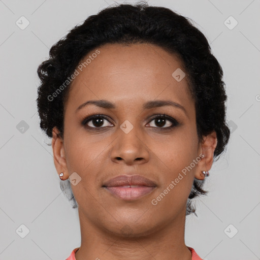 Joyful black young-adult female with short  black hair and brown eyes