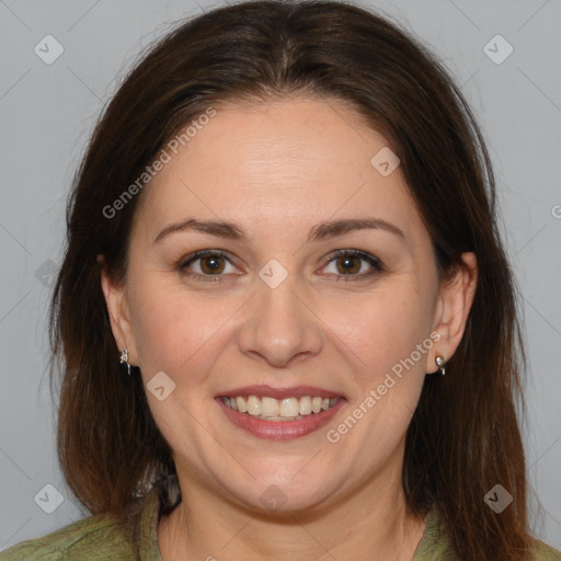 Joyful white adult female with medium  brown hair and brown eyes