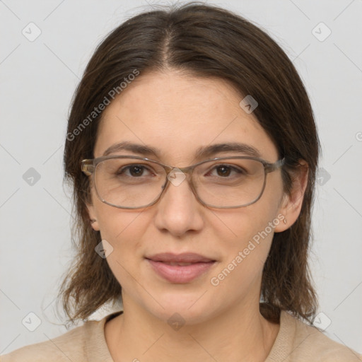 Joyful white adult female with medium  brown hair and brown eyes