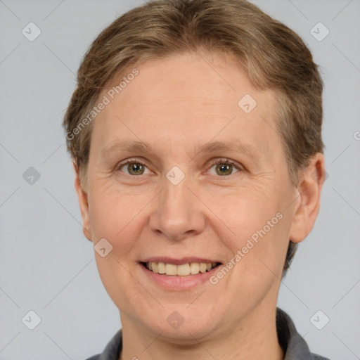 Joyful white adult female with short  brown hair and grey eyes