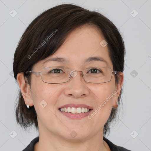 Joyful white adult female with medium  brown hair and grey eyes