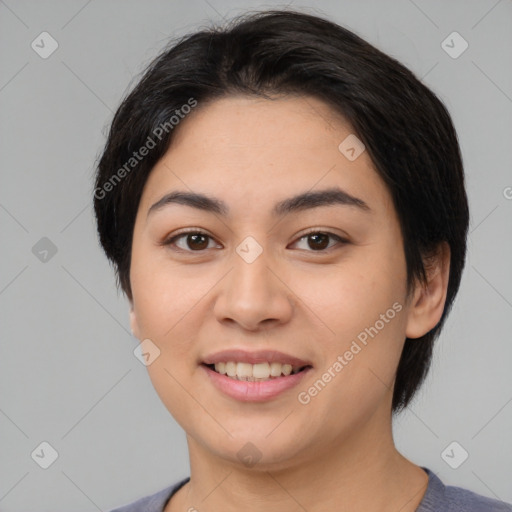 Joyful asian young-adult female with medium  black hair and brown eyes