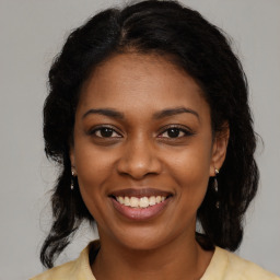 Joyful black young-adult female with medium  brown hair and brown eyes