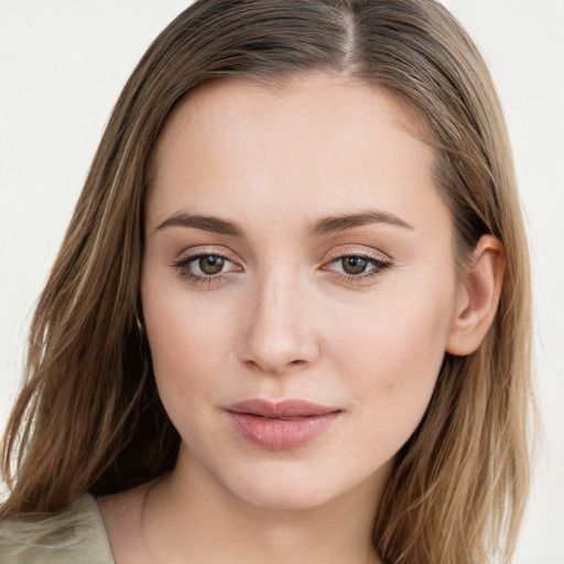 Joyful white young-adult female with long  brown hair and blue eyes