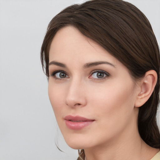 Neutral white young-adult female with medium  brown hair and brown eyes