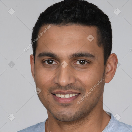 Joyful white young-adult male with short  black hair and brown eyes