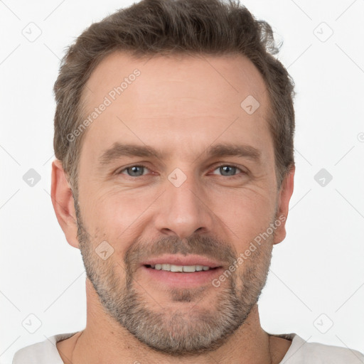 Joyful white adult male with short  brown hair and grey eyes