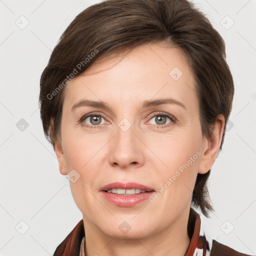 Joyful white adult female with medium  brown hair and grey eyes