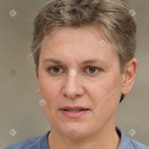 Joyful white adult female with short  brown hair and brown eyes