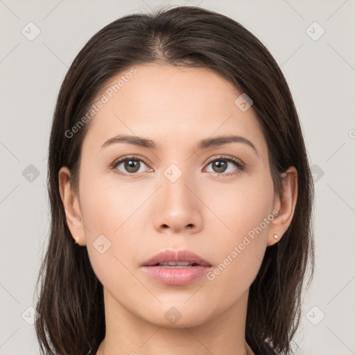 Neutral white young-adult female with long  brown hair and brown eyes