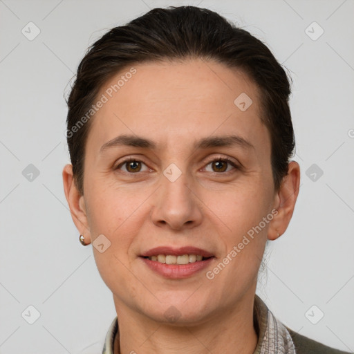 Joyful white adult female with short  brown hair and brown eyes