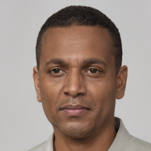 Neutral black adult male with short  black hair and brown eyes