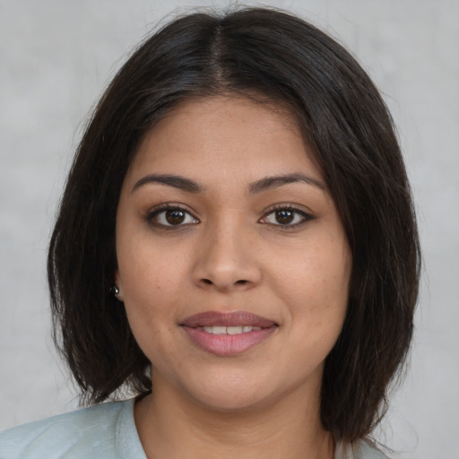Joyful white young-adult female with medium  brown hair and brown eyes
