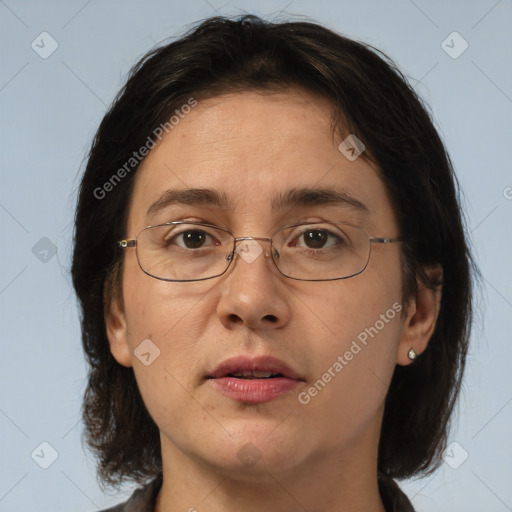 Joyful white adult female with medium  brown hair and brown eyes