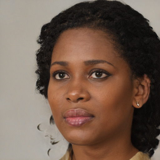 Neutral black young-adult female with medium  black hair and brown eyes