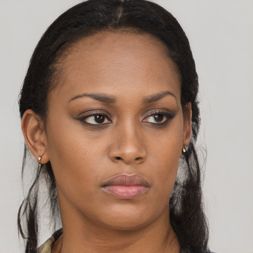 Neutral black young-adult female with long  brown hair and brown eyes
