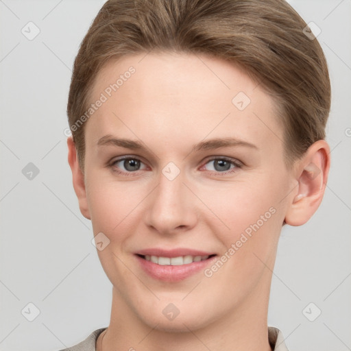 Joyful white young-adult female with short  brown hair and grey eyes