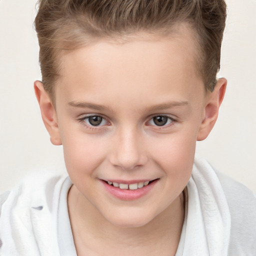 Joyful white child female with short  brown hair and brown eyes